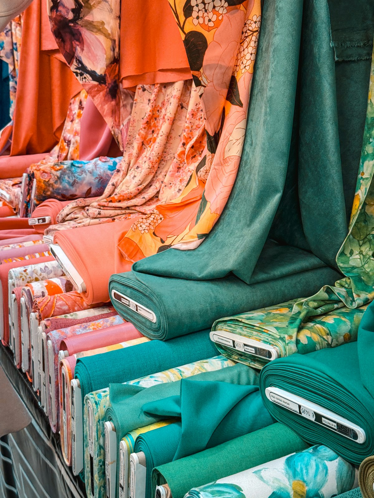 Neatly folded and stacked soft textured linen and blended fabrics